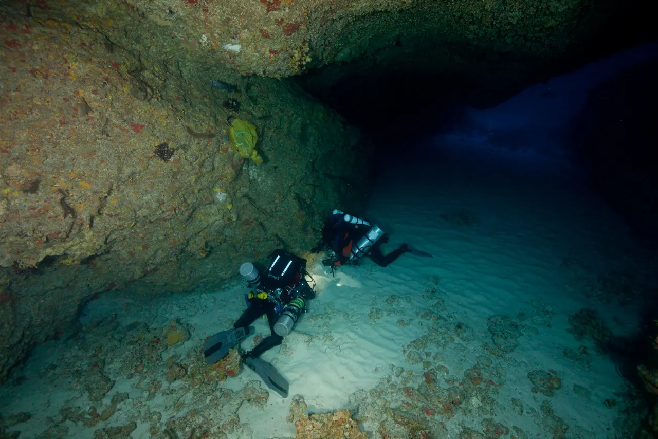 Cave survey divers